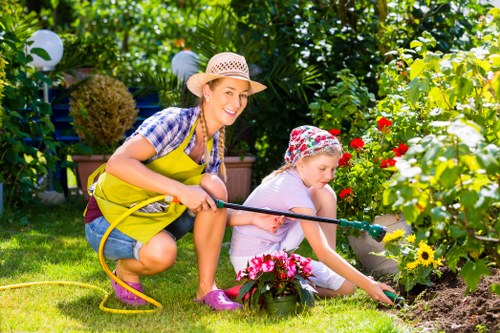 Gardener wearing protective equipment and using tools safely